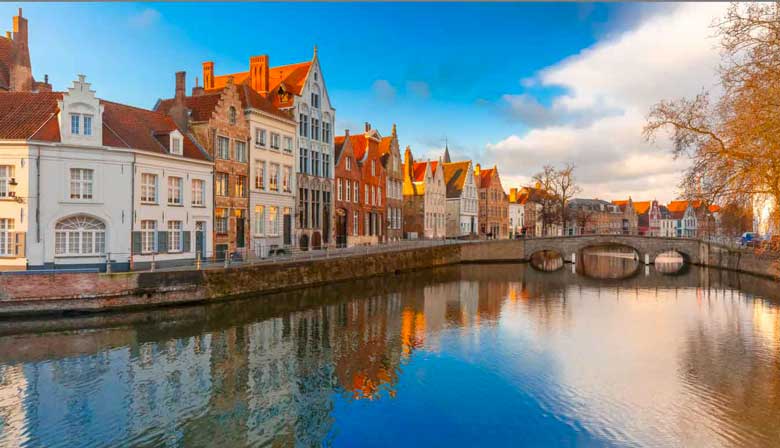 Canal along the colored houses in Bruges