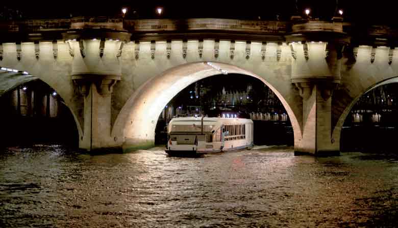 The Marina de Paris boat under a bridge