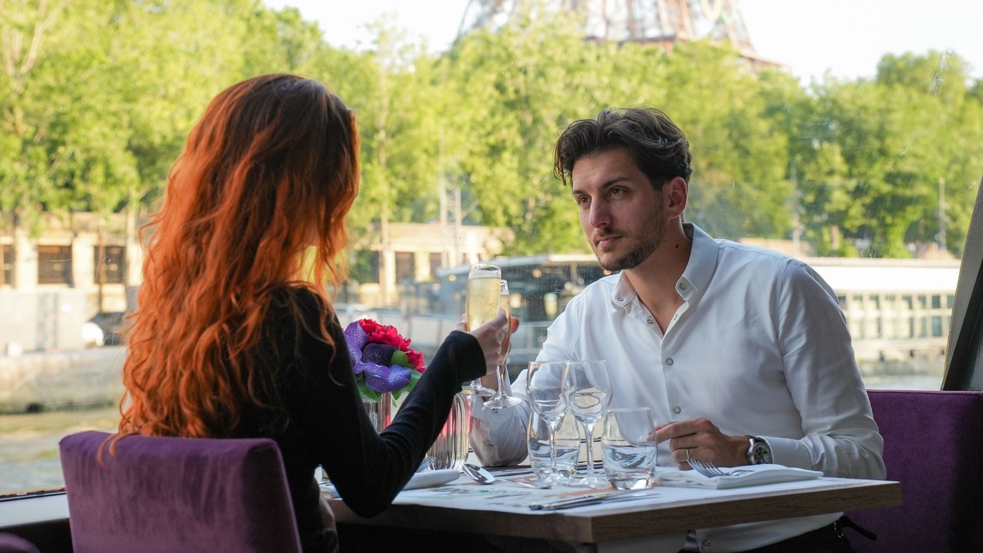 Couple enjoying lunch on the Seine River in Paris 
